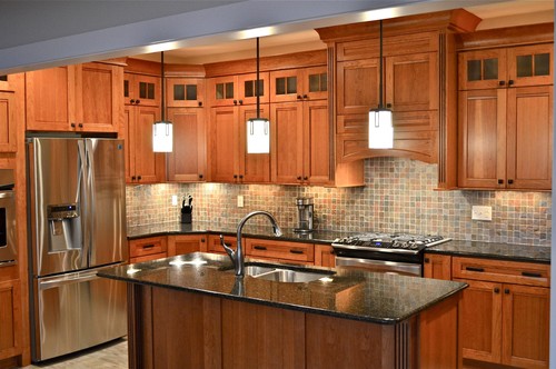 KraftMaid Cherry Cabinets, Natural Stone Mosaic Backsplash + Uba Tuba Granite
